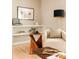 Cozy living space with a white chair, modern lamp, and stylish decor at 11673 W 28Th Ave, Lakewood, CO 80215
