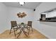 Cozy dining area with seating for two, adjacent to kitchen at 4661 S Decatur St # 109, Englewood, CO 80110