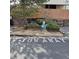 Designated dog area with waste disposal station and signage at 4661 S Decatur St # 109, Englewood, CO 80110