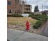 Exterior view of the Centennial Crossing with well-maintained landscaping and community signage at 4661 S Decatur St # 109, Englewood, CO 80110