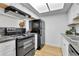 Well-maintained kitchen boasts black appliances and ample counter space for meal preparation and storage at 4661 S Decatur St # 109, Englewood, CO 80110