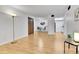 Open-concept living room with wood floors, dining area, and access to the kitchen at 4661 S Decatur St # 109, Englewood, CO 80110