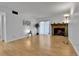 Bright living room featuring hardwood floors and a stone fireplace, perfect for relaxing or entertaining at 4661 S Decatur St # 109, Englewood, CO 80110