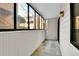 Enclosed porch with paneled walls provides fresh air and privacy for relaxing outside at 4661 S Decatur St # 109, Englewood, CO 80110