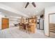 Basement game room features custom wet bar, stainless steel refrigerator, and pool table area at 5846 S Pike Dr, Larkspur, CO 80118
