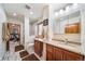 Bathroom with vanity and walk-in shower, with view into exercise room at 5846 S Pike Dr, Larkspur, CO 80118