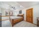 Finished basement bedroom with wood trim and ceiling fan at 5846 S Pike Dr, Larkspur, CO 80118