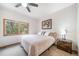 Inviting bedroom featuring neutral colors, carpet, ceiling fan, and picturesque window views at 5846 S Pike Dr, Larkspur, CO 80118