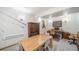 Finished basement with a dining area boasts wooden table and chairs, display cabinet, and decorative fishing gear at 5846 S Pike Dr, Larkspur, CO 80118