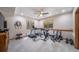 Finished basement exercise room features ceiling fan and multiple windows at 5846 S Pike Dr, Larkspur, CO 80118