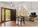 Bright foyer featuring hardwood floors, high ceilings, and a bench at 5846 S Pike Dr, Larkspur, CO 80118