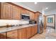 Kitchen featuring wood cabinetry, stainless steel appliances, and stone countertops at 5846 S Pike Dr, Larkspur, CO 80118