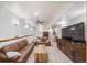 Finished basement with a cozy living area features recessed lighting, leather sofas, and ceiling fan at 5846 S Pike Dr, Larkspur, CO 80118