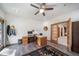 Home office with wood floors, ceiling fan, and access to outside at 5846 S Pike Dr, Larkspur, CO 80118