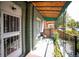 Inviting front porch with metal awning providing shade for a comfortable outdoor space at 3732 N Franklin St, Denver, CO 80205