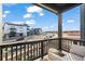 Relaxing balcony with comfortable seating and views of the street and nearby athletic field at 2127 Alcott Way, Broomfield, CO 80023