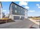 Modern townhouse with a tandem garage, hardiplank siding, and contemporary design at 2127 Alcott Way, Broomfield, CO 80023