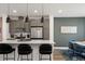 Stylish kitchen with stainless steel appliances, white countertops, and a view into the dining area at 2127 Alcott Way, Broomfield, CO 80023