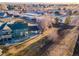 Green house with backyard and storage units nearby at 2131 Coronado Pkwy # A, Denver, CO 80229