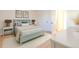 Light and airy bedroom with light teal bed frame and nightstands at 2131 Coronado Pkwy # A, Denver, CO 80229