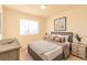 Bright bedroom with a cozy bed and plenty of natural light at 2131 Coronado Pkwy # A, Denver, CO 80229