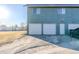 Attached garage with three garage doors at 2131 Coronado Pkwy # A, Denver, CO 80229