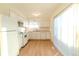 White kitchen with light countertops and modern appliances at 2131 Coronado Pkwy # A, Denver, CO 80229