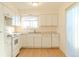 White kitchen with light countertops and modern appliances at 2131 Coronado Pkwy # A, Denver, CO 80229