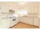 White kitchen with light countertops and modern appliances at 2131 Coronado Pkwy # A, Denver, CO 80229