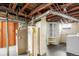 Unfinished basement with hot water heater, laundry and exposed plumbing at 1160 S Steele St, Denver, CO 80210