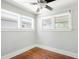 Bright bedroom with hardwood floors, ceiling fan and three windows at 1160 S Steele St, Denver, CO 80210