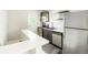 Modern kitchen with stainless steel appliances and white subway tile backsplash at 1160 S Steele St, Denver, CO 80210