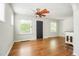 Living room featuring hardwood floors, ceiling fan and two windows at 1160 S Steele St, Denver, CO 80210
