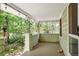 Covered porch with hanging lights, wood flooring and railing at 1160 S Steele St, Denver, CO 80210