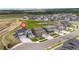 A daytime aerial view of a two-story home, showcasing its spacious yard and neighborhood at 17851 Herrera Dr, Parker, CO 80134