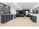 Finished basement with a wet bar, entertainment area, and light wood flooring is great for hosting guests at 17851 Herrera Dr, Parker, CO 80134