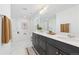 Bright and modern bathroom with a large vanity, soaking tub, and separate shower at 17851 Herrera Dr, Parker, CO 80134