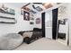 A bedroom with dark decor, posters, a beanbag chair, and carpet flooring at 17851 Herrera Dr, Parker, CO 80134