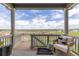 Relaxing covered patio with comfortable seating and scenic views offers a serene outdoor space at 17851 Herrera Dr, Parker, CO 80134