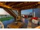Cozy covered patio with comfortable seating, string lights, and backyard view, perfect for outdoor relaxation at 17851 Herrera Dr, Parker, CO 80134