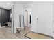 Bright entryway with a white front door, sleek mirror, and hardwood floors at 17851 Herrera Dr, Parker, CO 80134