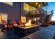 Inviting backyard fire pit with Adirondack chairs, perfect for outdoor entertaining and relaxation at 17851 Herrera Dr, Parker, CO 80134