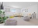 Cozy living room with comfortable white sectional sofa, bean bag chairs, and a large window at 17851 Herrera Dr, Parker, CO 80134
