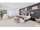 Spacious main bedroom with a dark accent wall, bright natural light, and stylish decor at 17851 Herrera Dr, Parker, CO 80134