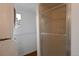 Bathroom includes a glass shower, stacked washer/dryer unit, and a window at 2493 S Kalispell Cir, Aurora, CO 80013
