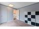 Neutral-toned bedroom featuring soft carpet, ample storage, and plenty of natural light at 2493 S Kalispell Cir, Aurora, CO 80013