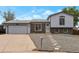 Charming split-level home featuring a brick facade, light blue siding, and a well-maintained front yard at 2493 S Kalispell Cir, Aurora, CO 80013