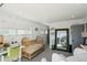 Bright and cozy Bedroom with playful dinosaur wallpaper and comfortable seating at 1299 Newton St, Denver, CO 80204
