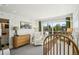 Bright Bedroom filled with natural light, featuring a crib and changing table at 1299 Newton St, Denver, CO 80204