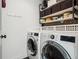 Convenient laundry room with modern washer and dryer and ample storage space at 1299 Newton St, Denver, CO 80204
